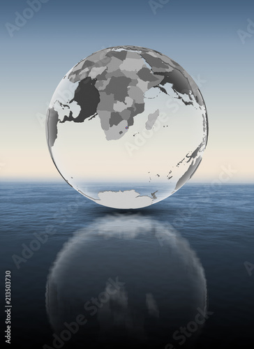 Swaziland on translucent globe above water