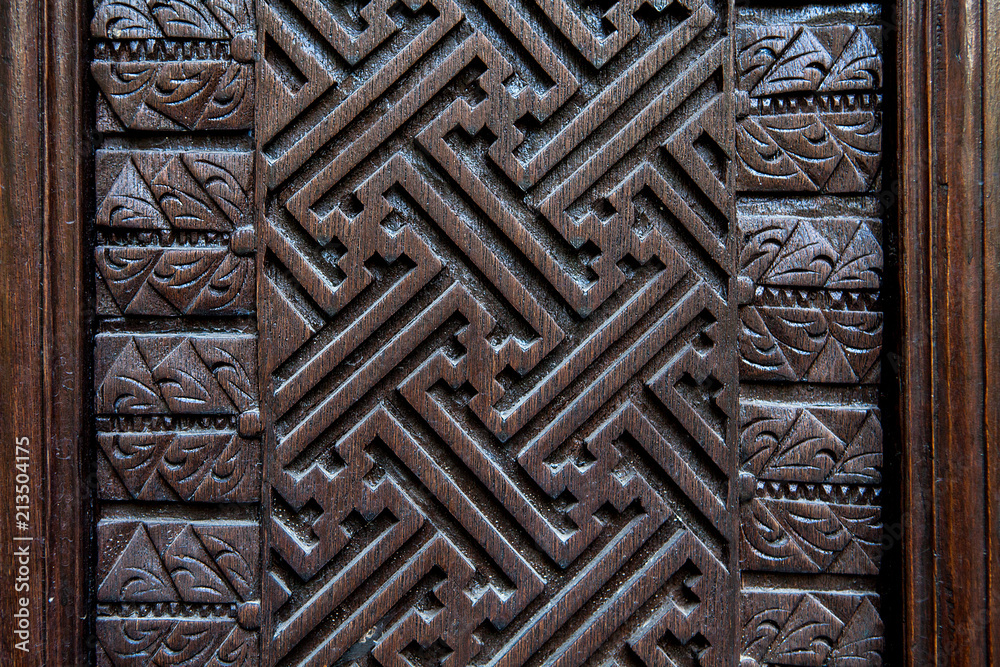 detail of old decorative wooden panel in bali indonesia detail of old decorative wooden panel in bali indonesia