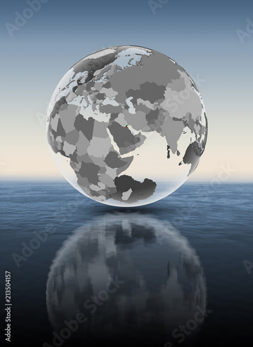 Kuwait on translucent globe above water