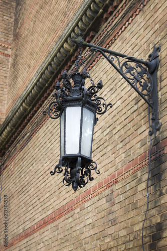 Photo of vintage Old Street Classic Iron Lantern On The House Wall, Close Up
