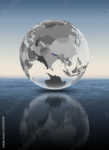Nepal on translucent globe above water