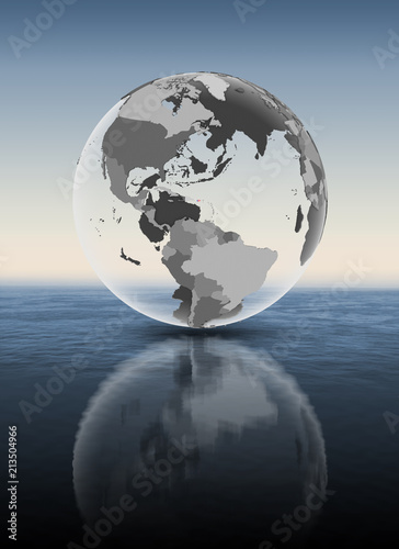 Puerto Rico on translucent globe above water