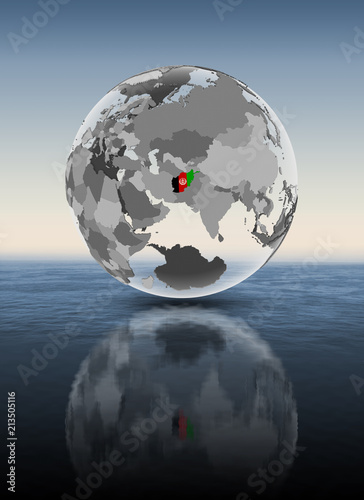 Afghanistan on translucent globe above water