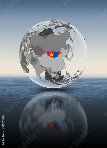 Fototapeta Naklejka Na Ścianę i Meble -  Mongolia on translucent globe above water