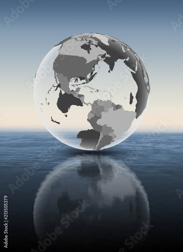 Jamaica on translucent globe above water