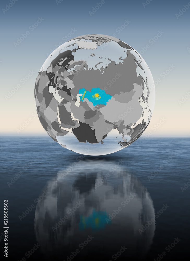 Naklejka premium Kazakhstan on translucent globe above water