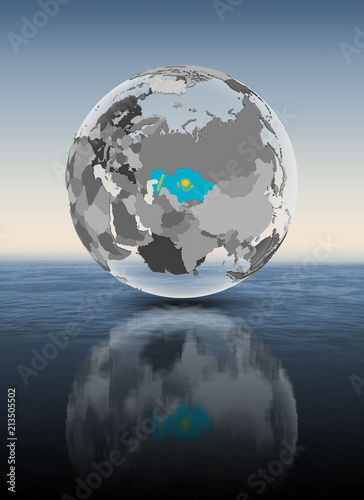 Kazakhstan on translucent globe above water
