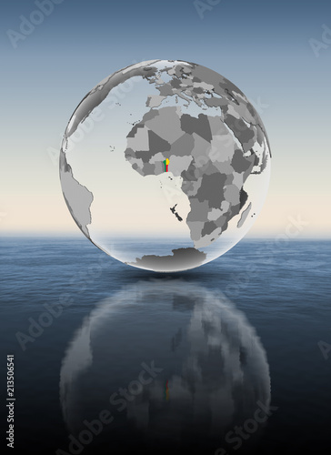 Benin on translucent globe above water