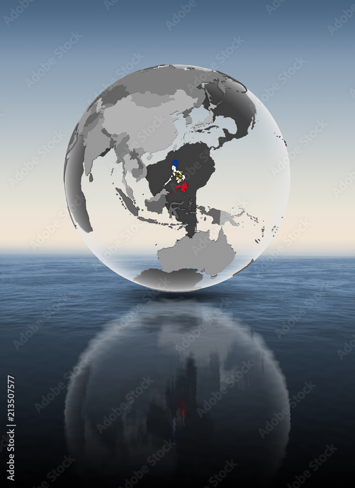 Fototapeta premium Philippines on translucent globe above water