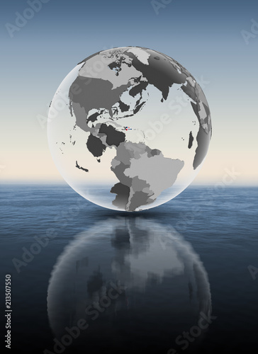 Dominican Republic on translucent globe above water