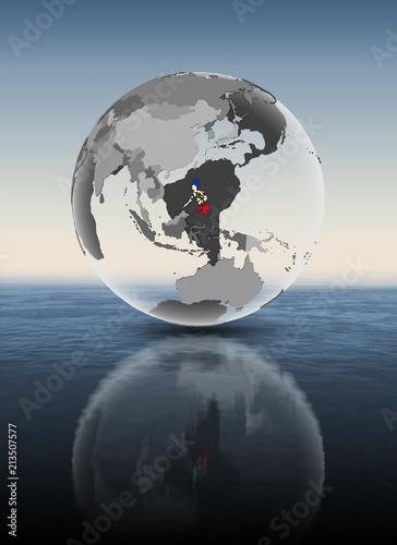 Fototapeta Naklejka Na Ścianę i Meble -  Philippines on translucent globe above water