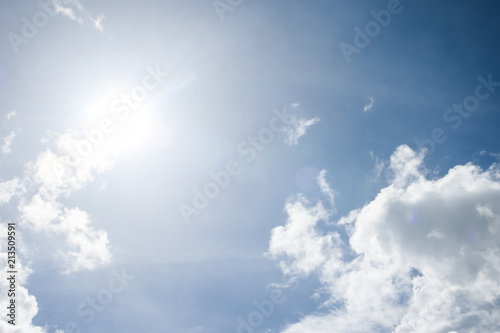 Sun and cloud on blue sky background