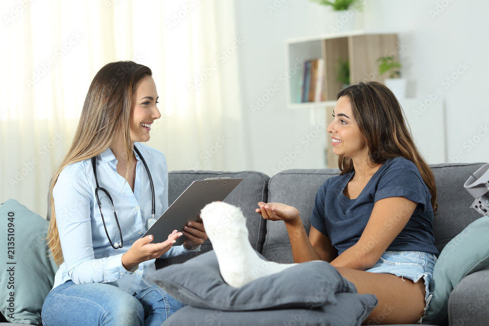 Doctor and patient talking at home Doctor and patient talking at home