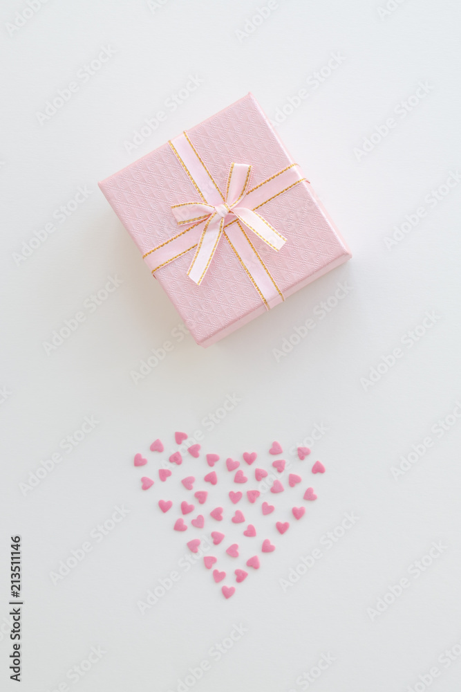 Pink gift or present box on table from above. Pink gift or present box on table from above.