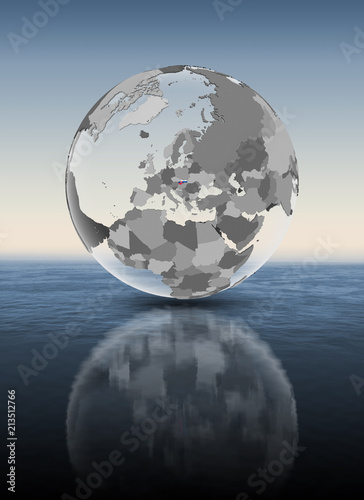 Slovakia on translucent globe above water