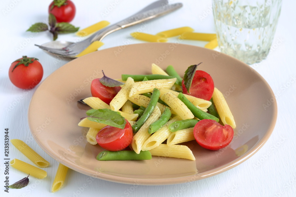 Penne pasta with green beans, cherry tomatoes and basil Penne pasta with green beans, cherry tomatoes and basil