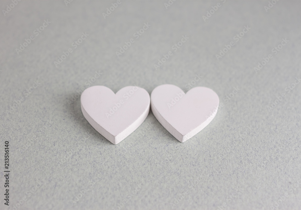Fototapeta premium two wooden hearts on craft background