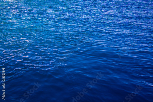 Deep blue sea with light ripples about to form little waves but as yet without much foam