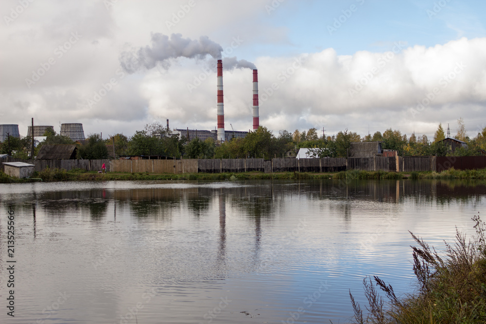 thermal power station on the lake shore on a summer day