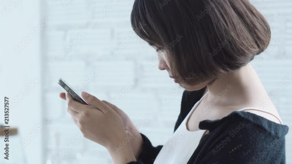 woman looking and playing mobile phone. woman looking and playing mobile phone.