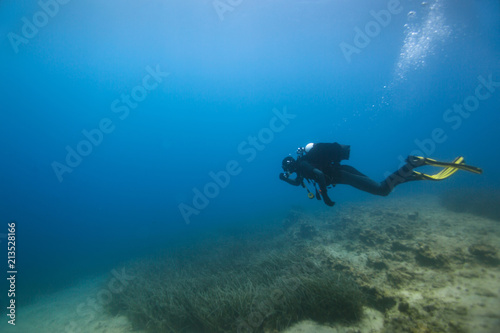 Scuba diver deep underwater