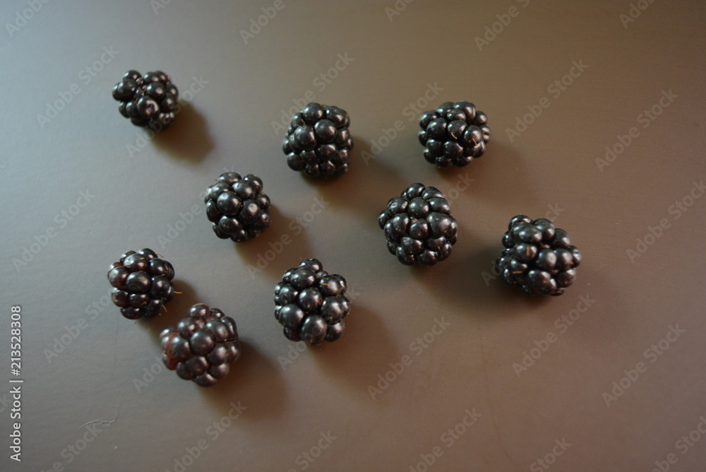 Freshly picked blackberries on a brown matte background Freshly picked blackberries on a brown matte background