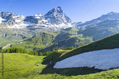 green hills with snow in view to Alps peak in Italy © sergejson