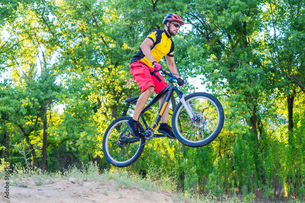 Naklejka premium The concept of extreme cycling, a mountain bike jump.