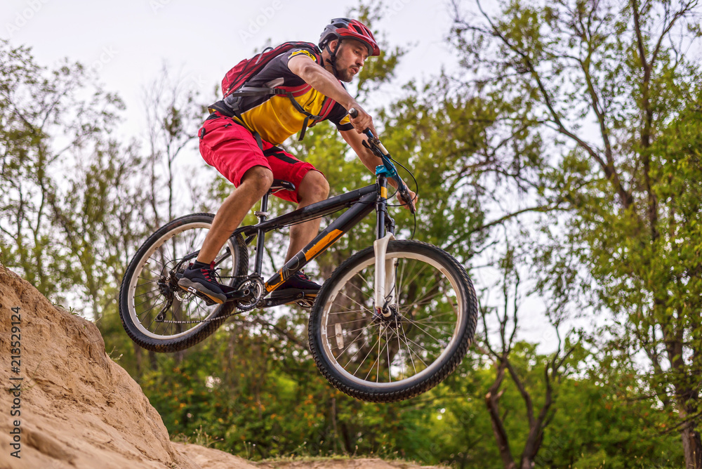 The concept of extreme cycling, a mountain bike jump.