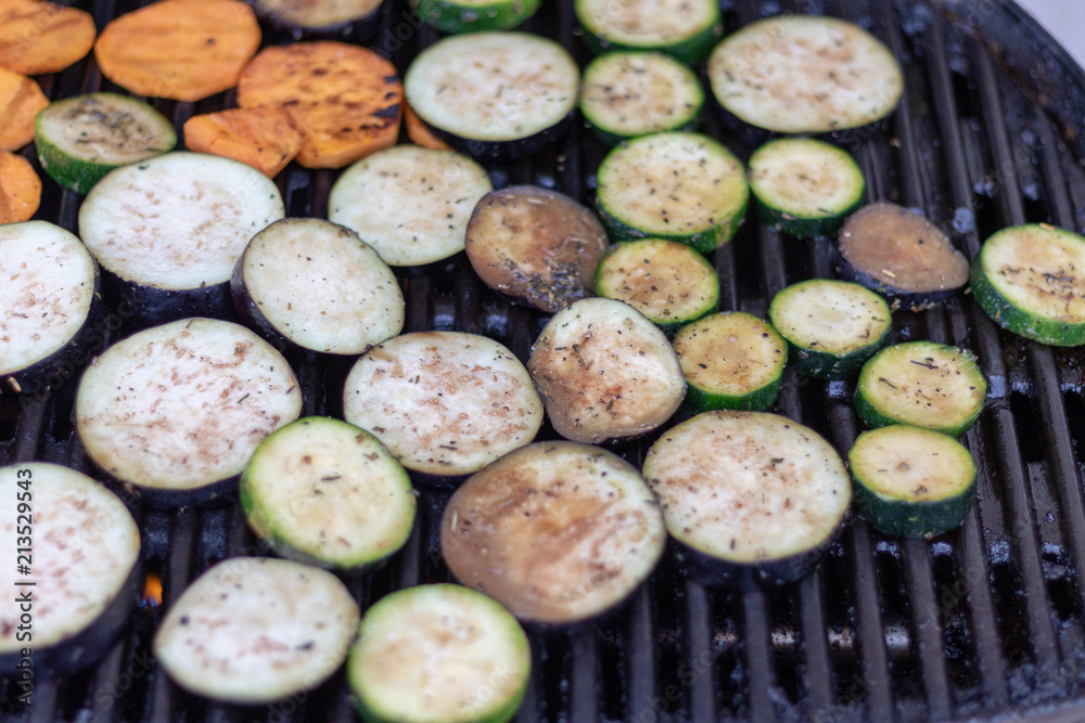 Top view on vegetable slices on the grillage for barbecue Top view on vegetable slices on the grillage for barbecue