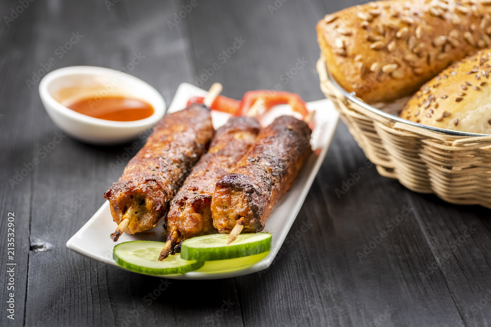 kebab on sticks served with vegetables kebab on sticks served with vegetables