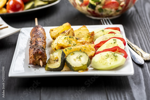 kebab on sticks served with vegetables