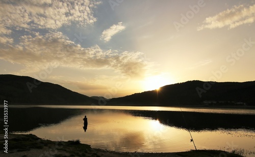 A fisherman on the lake