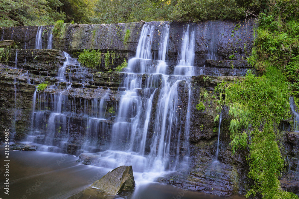 Fototapeta premium Small waterfall near village Ripit i Pruit, Catalonia, Spain