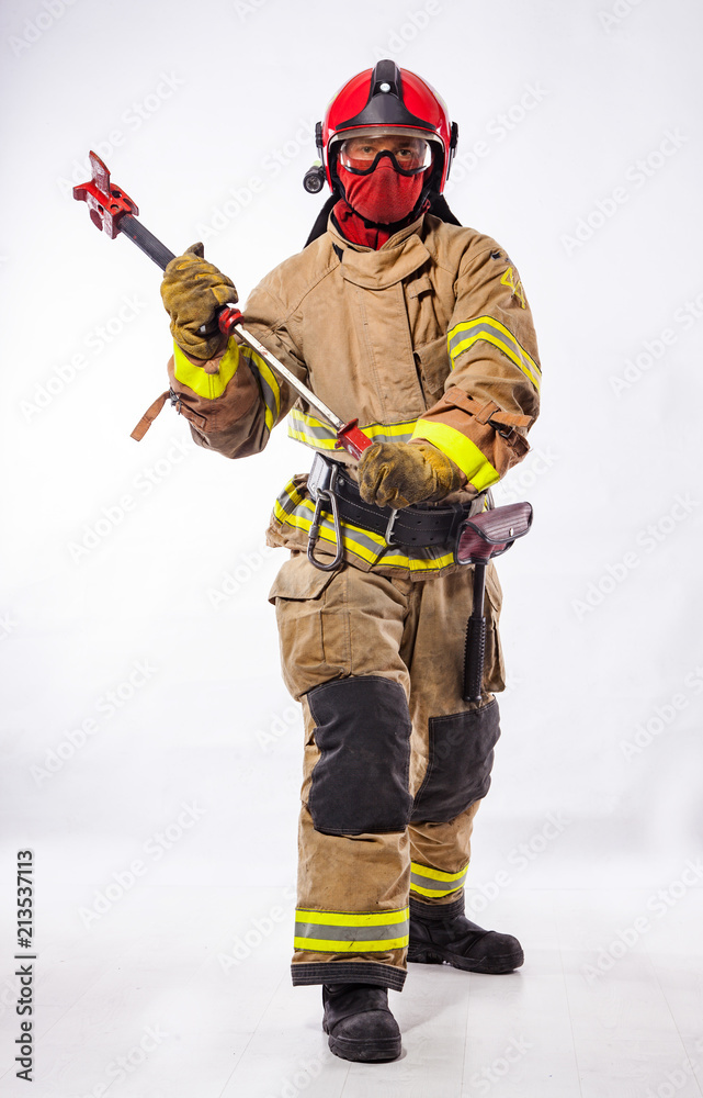 Man in uniform holding fire ax Man in uniform holding fire ax