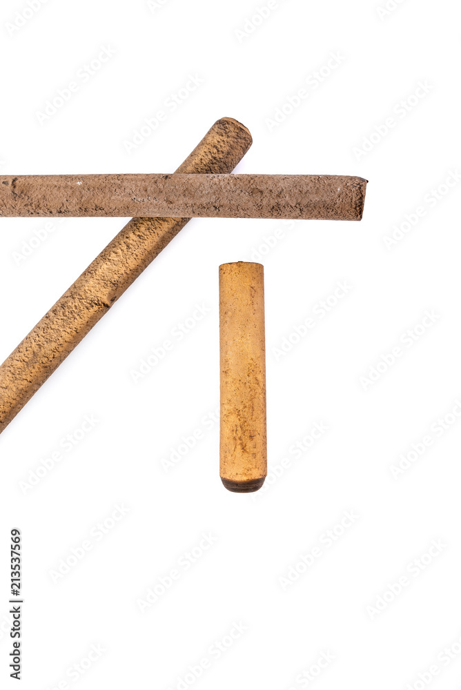 Ebonite sticks isolated on white background. Also is known as hard rubber or vulcanite Ebonite sticks isolated on white background. Also is known as hard rubber or vulcanite