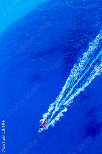 A Boat on a Pure Blue Sea