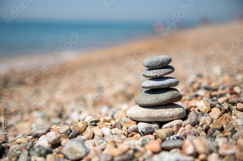 Balance of stones on the beach  sunny day