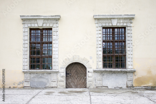 A window with a lattice of an ancient building photo