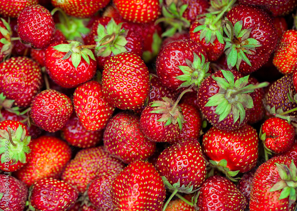 background from freshly raw harvested strawberries just picked up, directly above background from freshly raw harvested strawberries just picked up, directly above