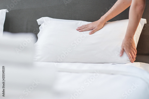 Hands Making Bed from Hotel Room Service