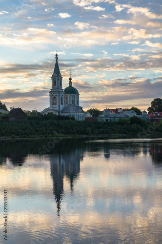 Boundless sky over the Volga river in the early morning. Ancient Monastery of St.Catherine. City of Tver, Russia.