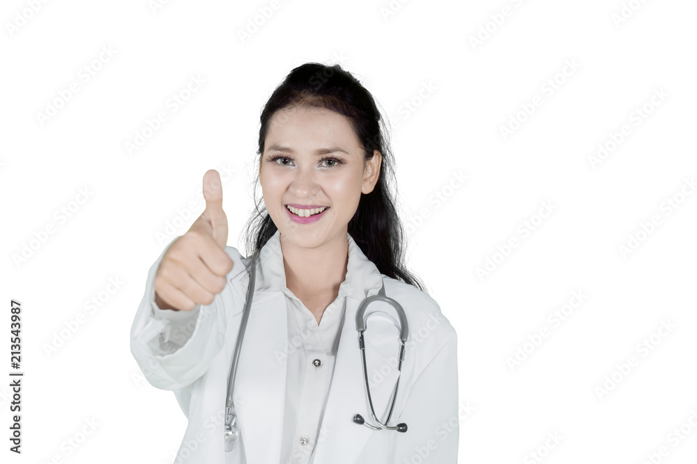 Beautiful doctor showing her thumb on studio Beautiful doctor showing her thumb on studio