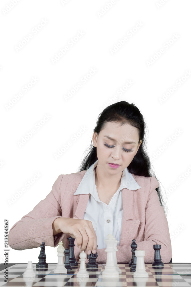 Caucasian businesswoman playing chess on studio Caucasian businesswoman playing chess on studio