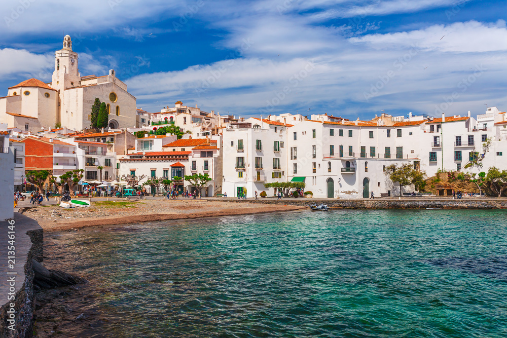 Sea landscape with Cadaques, Catalonia, Spain near of Barcelona. Scenic old town with nice beach and clear blue water in bay. Famous tourist destination in Costa Brava with Salvador Dali landmark