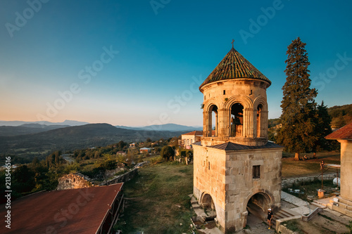 Kutaisi, Georgia. Bell Tower Of Gelati Monastery In Evening Time