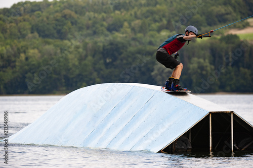 Wakeboarder surfing a trick 