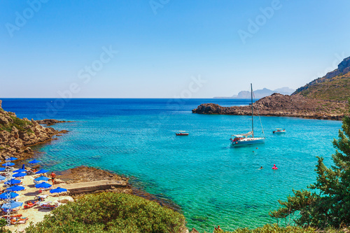 Sea skyview landscape photo Anthony Quinn bay near Ladiko bay on Rhodes island, Dodecanese, Greece. Panorama with nice sand beach and clear blue water. Famous tourist destination in South Europe