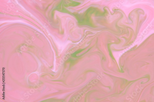 Pink green holographic background, pink water droplets, multicolored pattern, food colors in milk, color texture on the water, blank for the designer