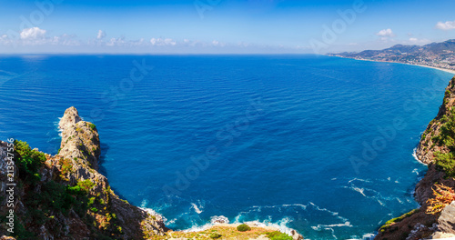 Beautiful sea panorama landscape of Alanya Castle in Antalya district, Turkey, Asia. Famous tourist destination with high mountains. Summer bright day and sea shore